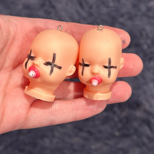 2pcs Baby Doll Head cross over eyes charms