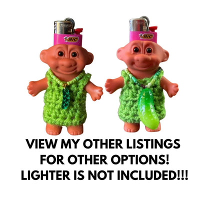 Troll Lighter covers. Both wearing green dress. One has a small pickle necklace and the other is  large pickle necklace
