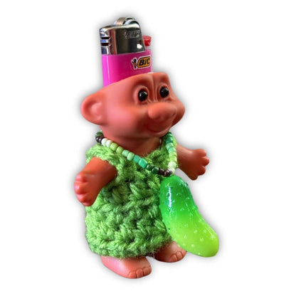 Side view of pickle necklace on troll lighter cover